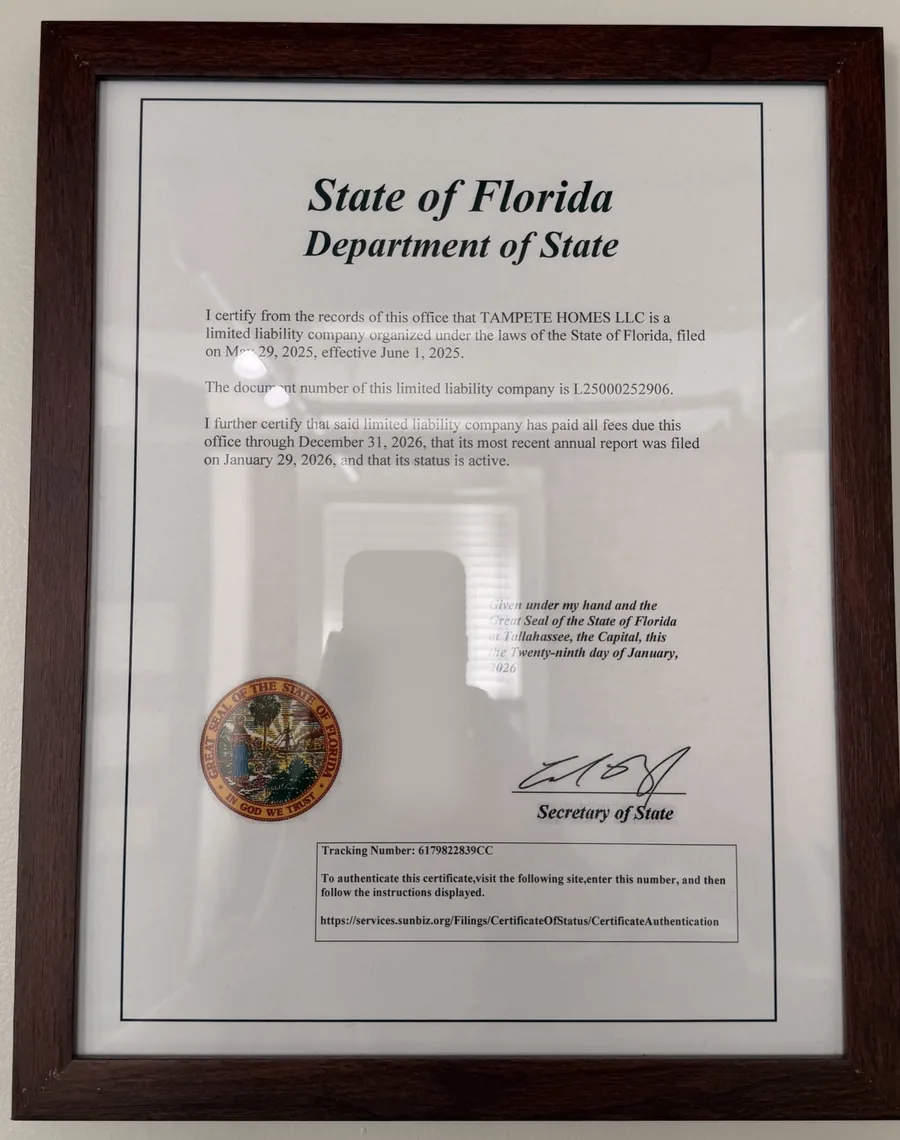 Framed State of Florida Department of State certificate of status for Tampete Homes LLC, document number L25000252906, stating that its status is active